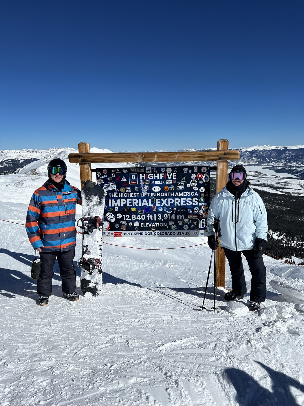 Bidwell Cranage at the top of the Imperial Express lift at Breckenridge, Colorado, beside the 12,840 foot elevation sign