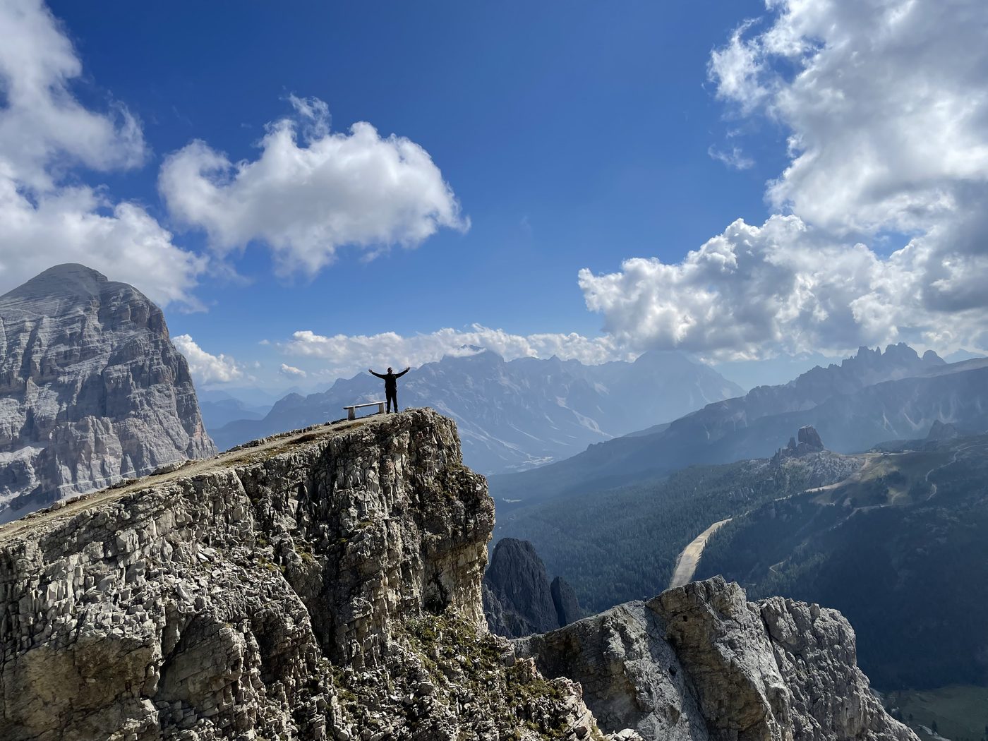 Bidwell Cranage standing on a clifftop overlook in the Italian Dolomites