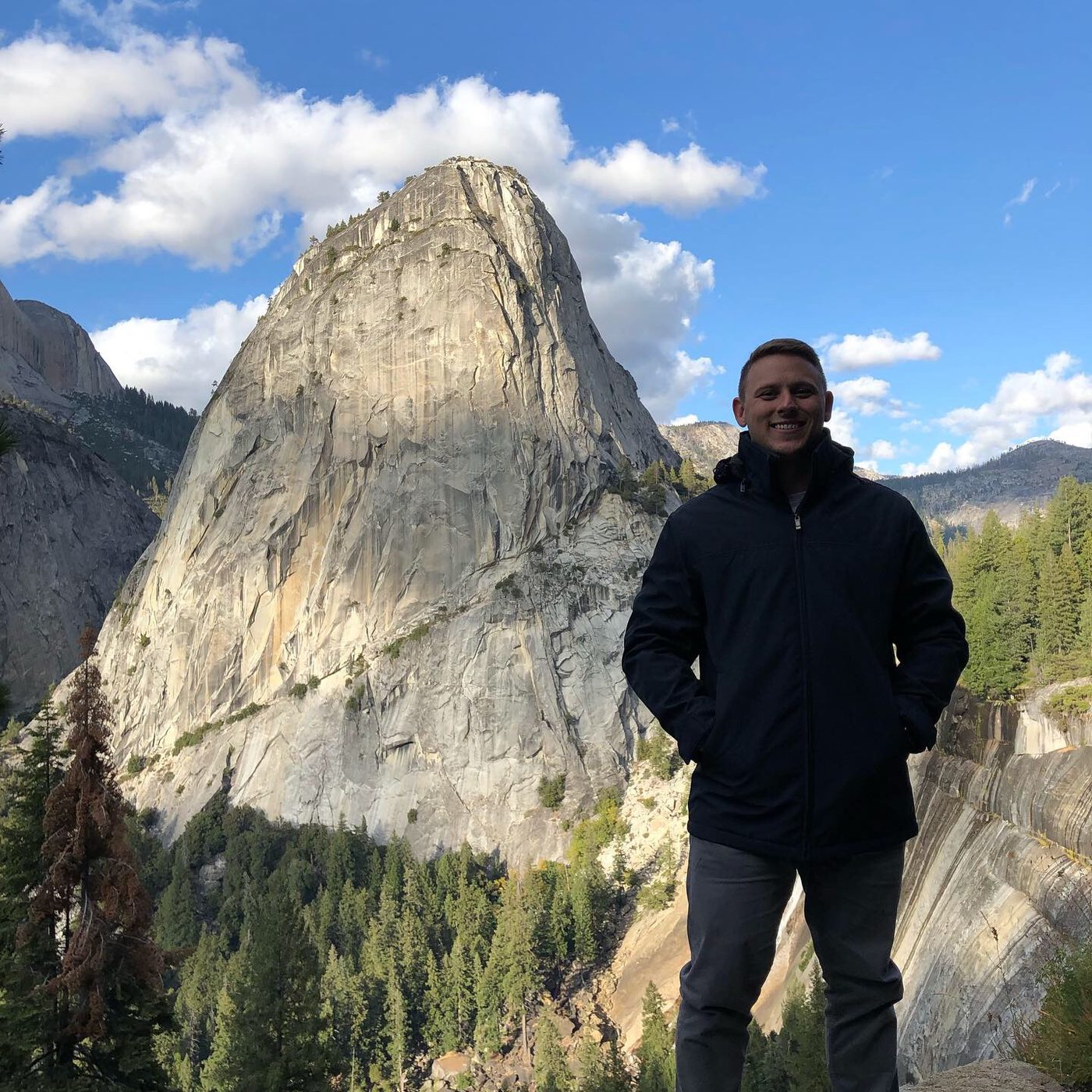 Bidwell Cranage, founder of Bidwell Health, smiling outdoors in front of a granite peak